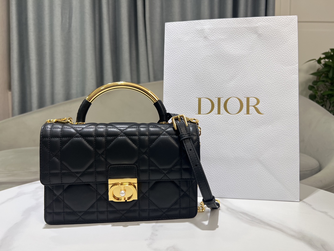 Large P1400The Dior Ange handbag, new to the Fall 2014 Ready-to-Wear collection, opens Dior's new collection with an elegantly chic aesthetic crafted in black leather with oversized rattan check stitching and stiffened, vintage gold-tone metal top handles engraved with the Christian Dior Paris logoFlap flap decorated with a resin-beaded, embellished CD claspSewn in triangular lining with two spacious compartments and a slit pocket. Triangular lined silhouette with two spacious compartments and a slip pocket for storing everyday essentialsElegant design in a medium sizeAdjustable, detachable chain shoulder strap made of gold-tone metal with resin beadwork embellishmentsCan be carried in a handheld position, over the shoulder or across the bodyCode: 4402Measurements: 25x 16x 8 cm (L x H x W)-High-Fashion Factory