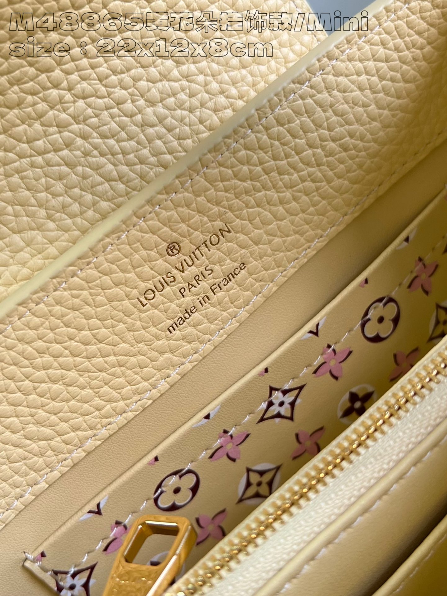 P2200 M8865 Yellow Flower Charm/Mini M11351 This Capucines East-West mini bag in Taurillon cowhide leather is rendered in the bright hues of a late summer afternoon and finished with a detachable Monogram floral leather trim for a touch of spunky interest. 22 x 12 x 8 cm (L x H x W) N