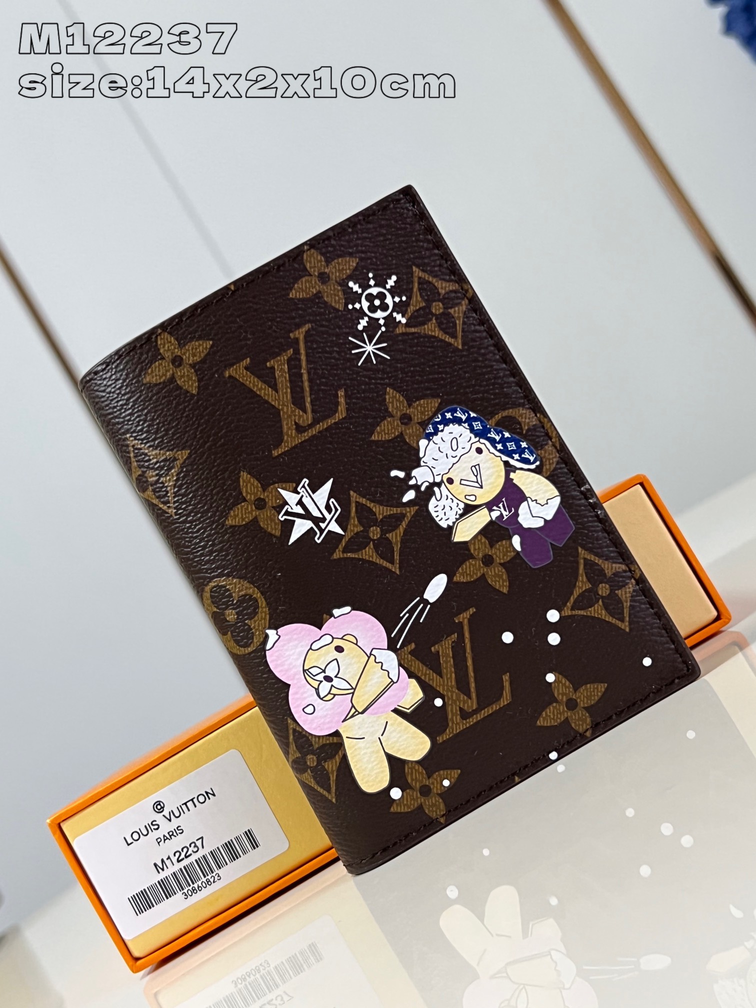 M12237 This passport holder features the brand's mascot Vivienne showcasing the Snow Show collection in Monogram canvas depicting LV snowflakes and a cuddly polar bear leather lining with eye-catching details Flap pockets and card slots for organized storage 14 x 2.5 x 10 cm (H x W x L)