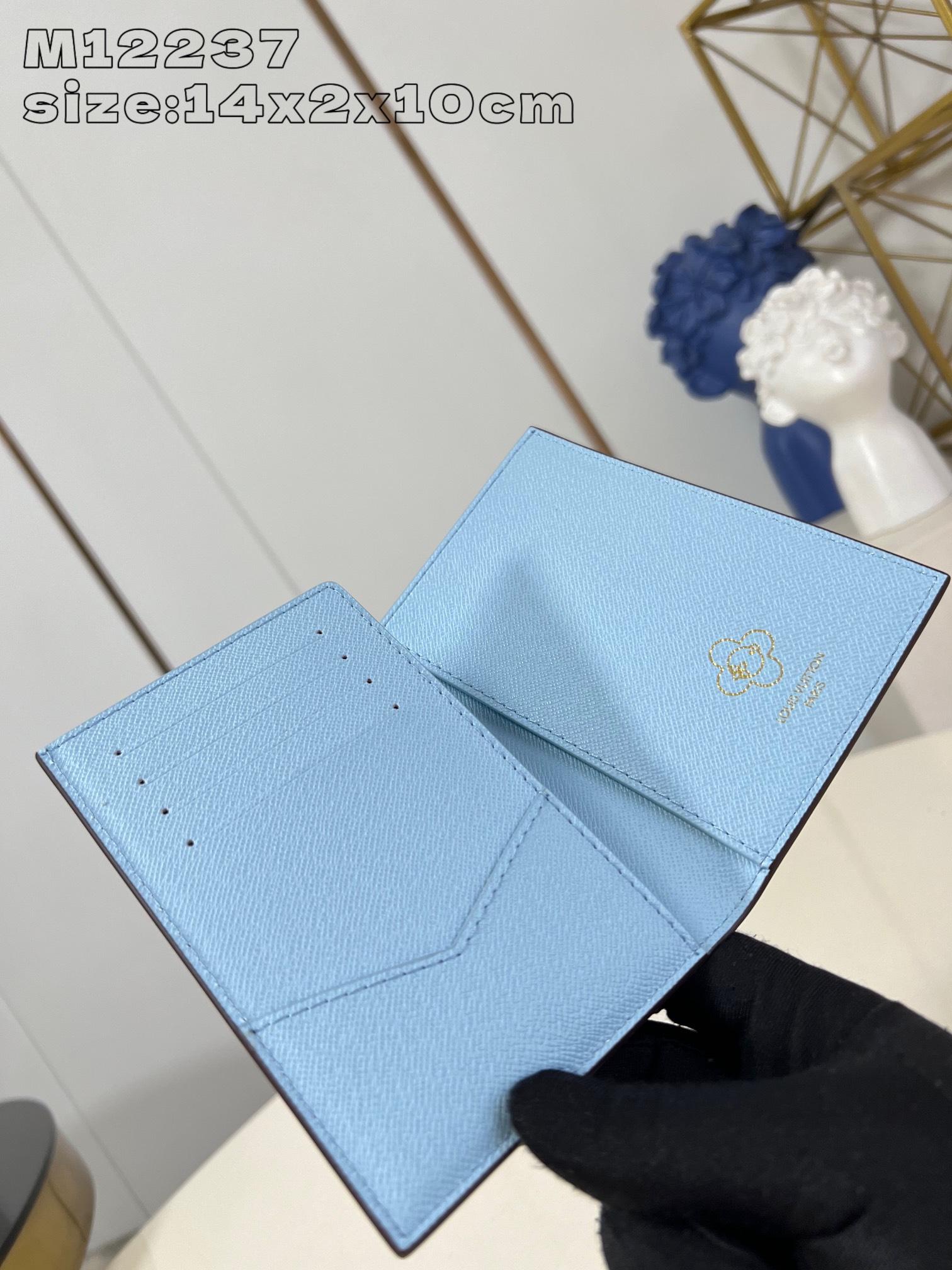 M12237 This passport holder features the brand's mascot Vivienne showcasing the Snow Show collection in Monogram canvas depicting LV snowflakes and a cuddly polar bear leather lining with eye-catching details Flap pockets and card slots for organized storage 14 x 2.5 x 10 cm (H x W x L)