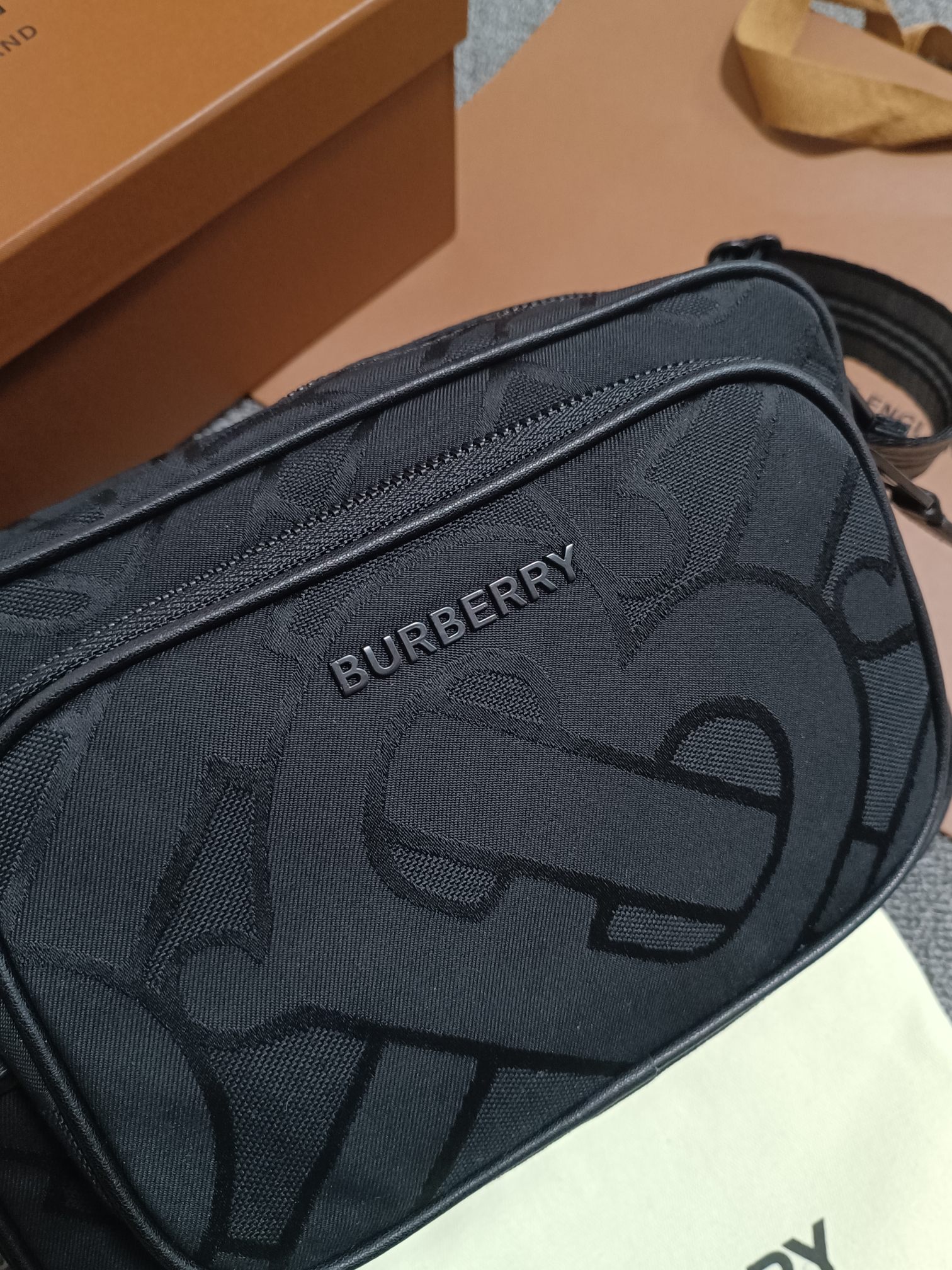 Black Burberry camera bag Crafted from recycled polyester and cotton yarns and decorated with Thomas Bur's exclusive logo patterned jacquard with the brand's logoCan be worn diagonally or with the adjustable signature striped mesh nylon strapCarrying dimensions:21.5 - 7 - 15.5cm- high quality bags