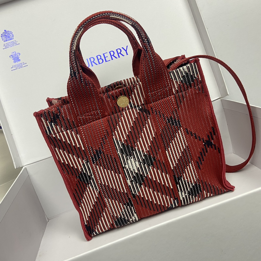 Burberry Red Tote Bag Size: 25 x 11 x 22cm. Minimum vertical wearable length of shoulder strap: 45cm. Maximum vertical wearable length of shoulder strap: 48cm. Soft and supple tote bag crafted in Italian knit and decorated with Burberry check pattern in a lightweight, unlined design with engraved Equestrian Knight logo (EKD) snap closure.- Detachable crossbody strap- Snap button closure- Zippered inside pocket- Brushed metal hardware- Engraved equestrian rider logo on closure