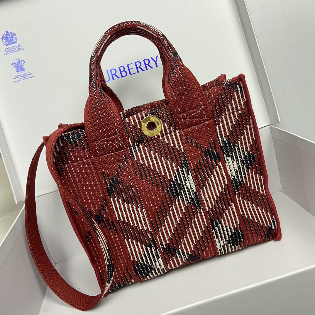 Burberry Red Tote Bag Size: 25 x 11 x 22cm. Minimum vertical wearable length of shoulder strap: 45cm. Maximum vertical wearable length of shoulder strap: 48cm. Soft and supple tote bag crafted in Italian knit and decorated with Burberry check pattern in a lightweight, unlined design with engraved Equestrian Knight logo (EKD) snap closure.- Detachable crossbody strap- Snap button closure- Zippered inside pocket- Brushed metal hardware- Engraved equestrian rider logo on closure