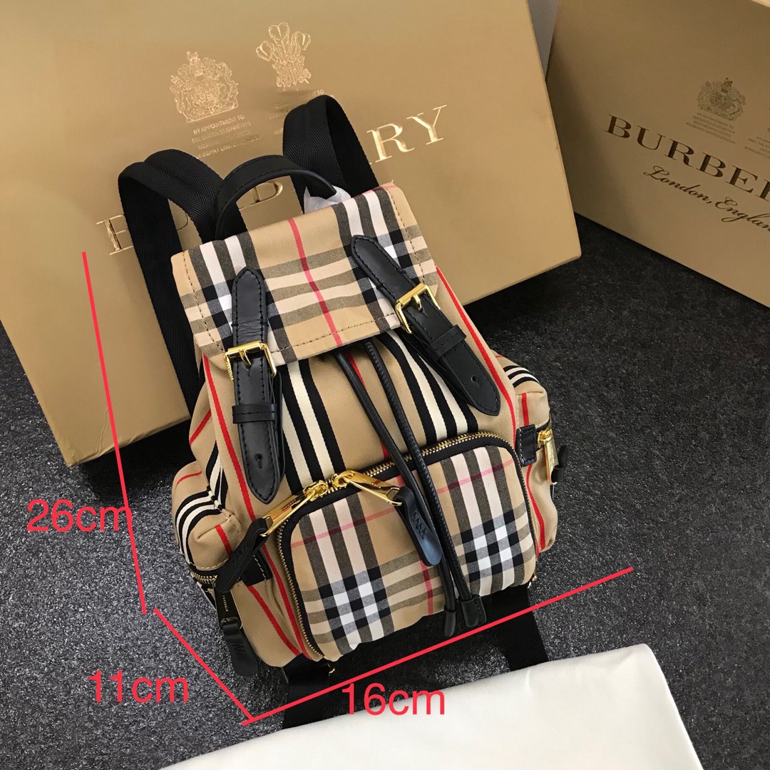 Burberry Small Vintage Striped Patchwork Cowhide Military Backpack Checkered Cotton Fabric Crafted Decorative Sequined Cowhide Trim 3 zippered exterior pockets; 1 interior welt pocket; 1 interior pocket Size: 16 x 11 x 26cm