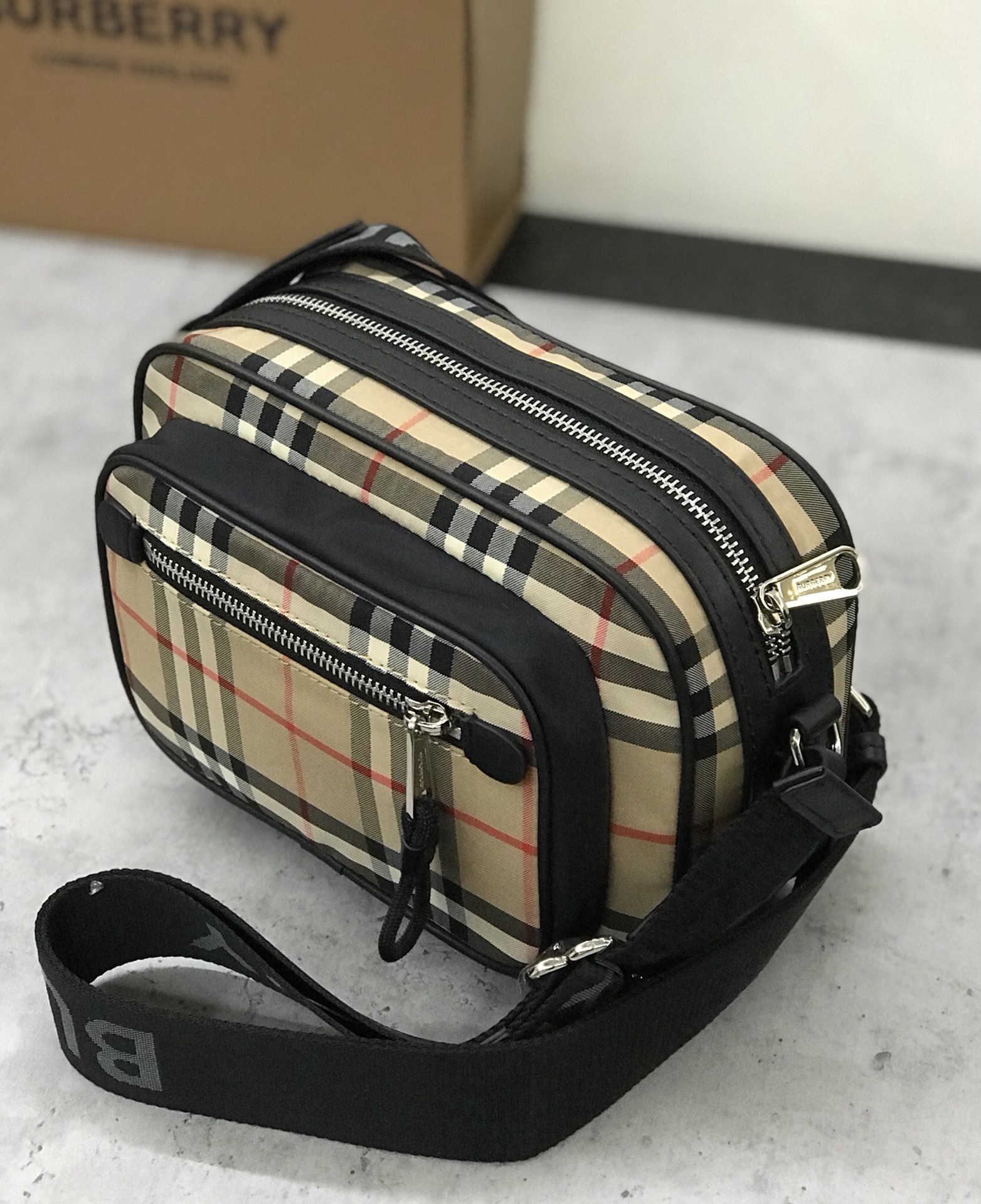 Burberry's smart slouchy backpack is crafted from vintage plaid bonded cotton with fine leather trims and jacquard worsted branding logo and features adjustable mesh nylon straps for slouchy or shoulder carry. 22.5 x 8.2 x 14.5cm!