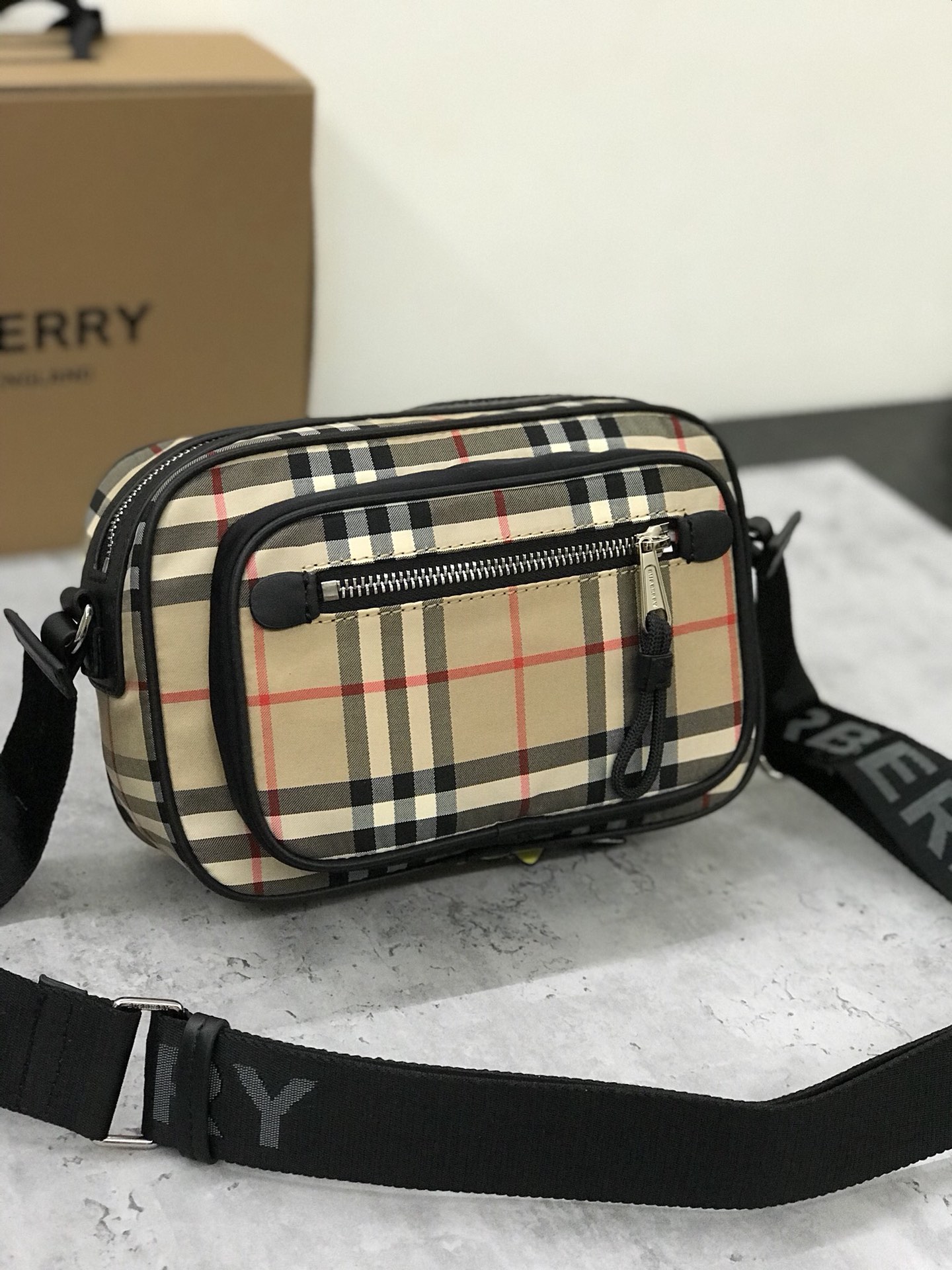 Burberry's smart slouchy backpack is crafted from vintage plaid bonded cotton with fine leather trims and jacquard worsted branding logo and features adjustable mesh nylon straps for slouchy or shoulder carry. 22.5 x 8.2 x 14.5cm!