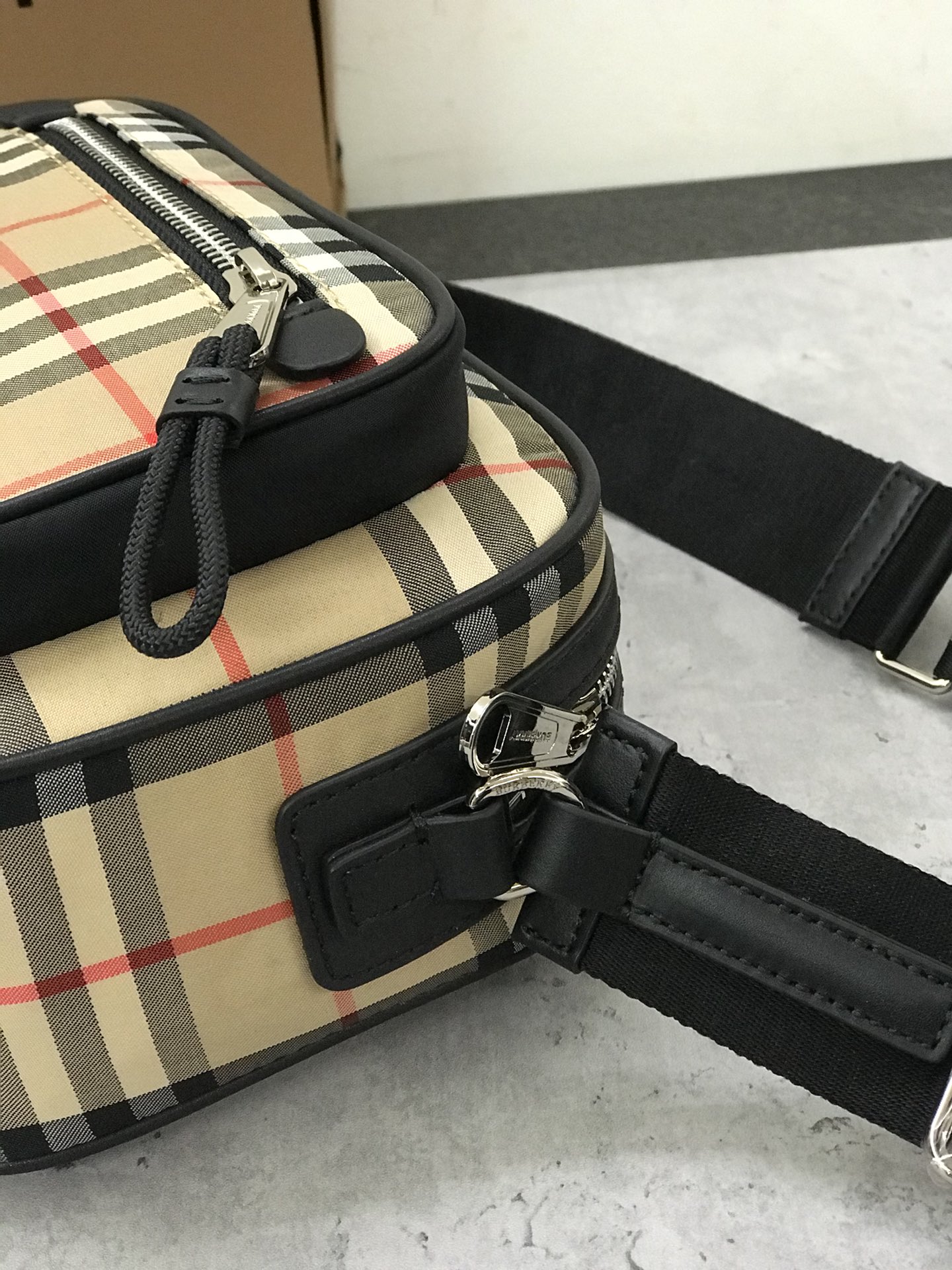 Burberry's smart slouchy backpack is crafted from vintage plaid bonded cotton with fine leather trims and jacquard worsted branding logo and features adjustable mesh nylon straps for slouchy or shoulder carry. 22.5 x 8.2 x 14.5cm!