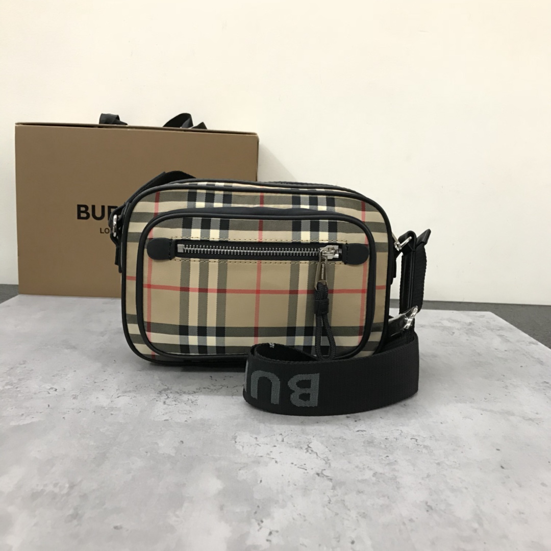 Burberry's smart slouchy backpack is crafted from vintage plaid bonded cotton with fine leather trims and jacquard worsted branding logo and features adjustable mesh nylon straps for slouchy or shoulder carry. 22.5 x 8.2 x 14.5cm!