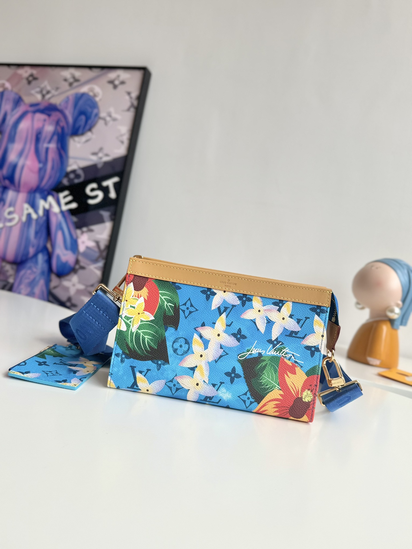 P840 M83466 Surf's Up This Gaston mini bag in Monclerogram Surfin' canvas showcases Pharrell Williams' summery take on colorful prints and is compact enough to hold a smartphone and a short money clip. Crossbody size: 22 x 14.5 x 4.5cm