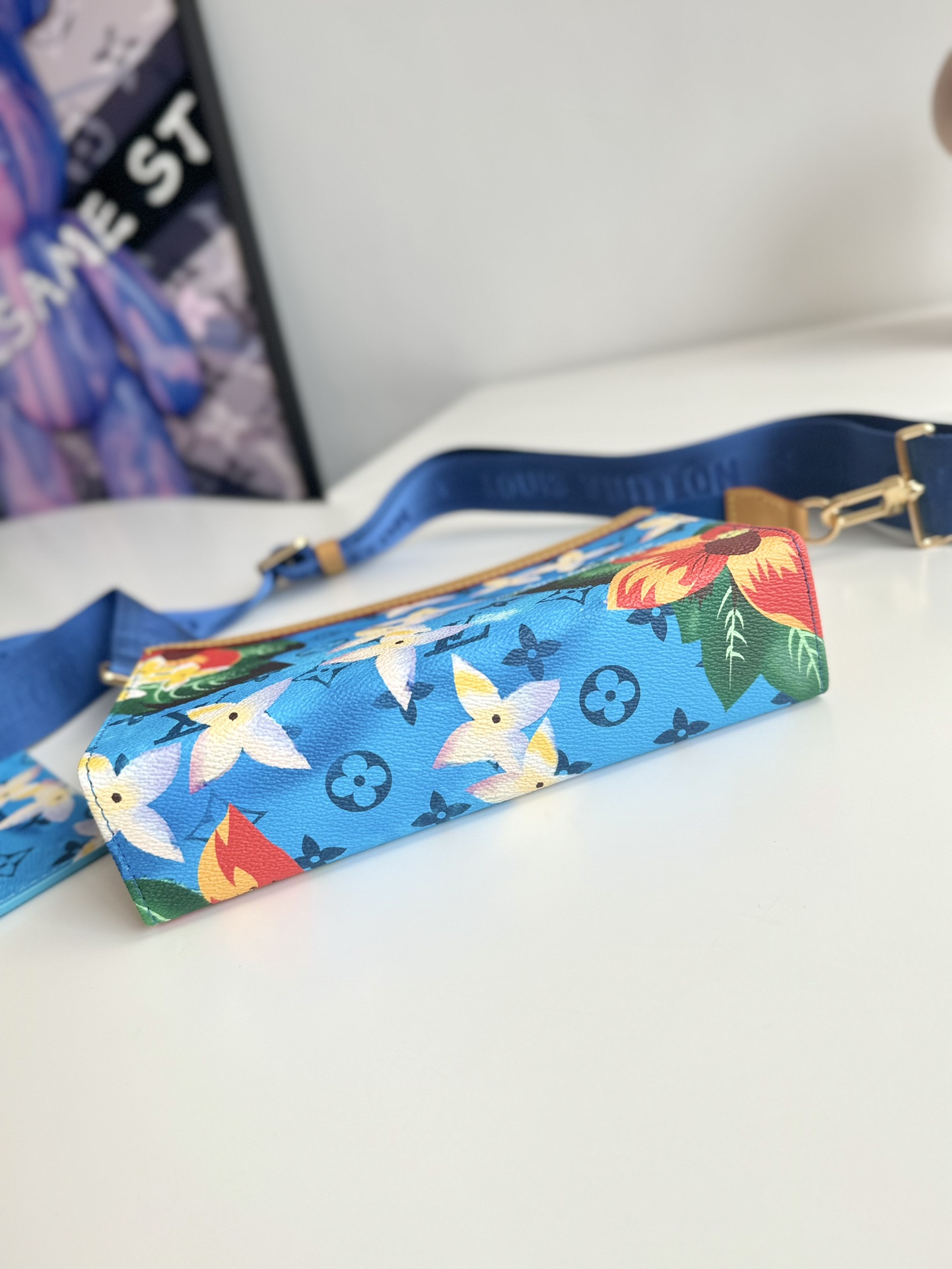 P840 M83466 Surf's Up This Gaston mini bag in Monclerogram Surfin' canvas showcases Pharrell Williams' summery take on colorful prints and is compact enough to hold a smartphone and a short money clip. Crossbody size: 22 x 14.5 x 4.5cm