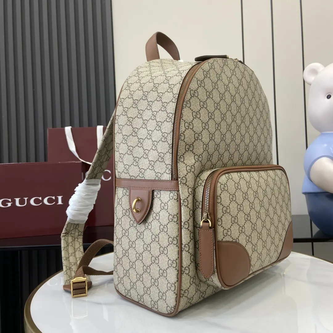 p1380 Gucci Brown Emblem Shoulder Bag Men's travel accessories reinterpret the timeless elegance and craftsmanship of the brand This backpack is crafted in the new beige and dark brown GG monogrammed fabrics Multi-functional pockets inside and D-rings on the outside for hanging accessoriesNew GG monogrammed fabric in beige and dark brownBrown leather pipingCotton liningpadded backInterior: 1 padded laptop compartment, 1 pen pocket and 1 zippered pocketExterior: 1 zippered front pocket and 1 D-ringZipper closureModel: 821159Dimensions: 31cm (W) x 41cm (H) x 18cm (D)Weight: approx. 1.45 kgColor: brown pvc/originalItalian Creation