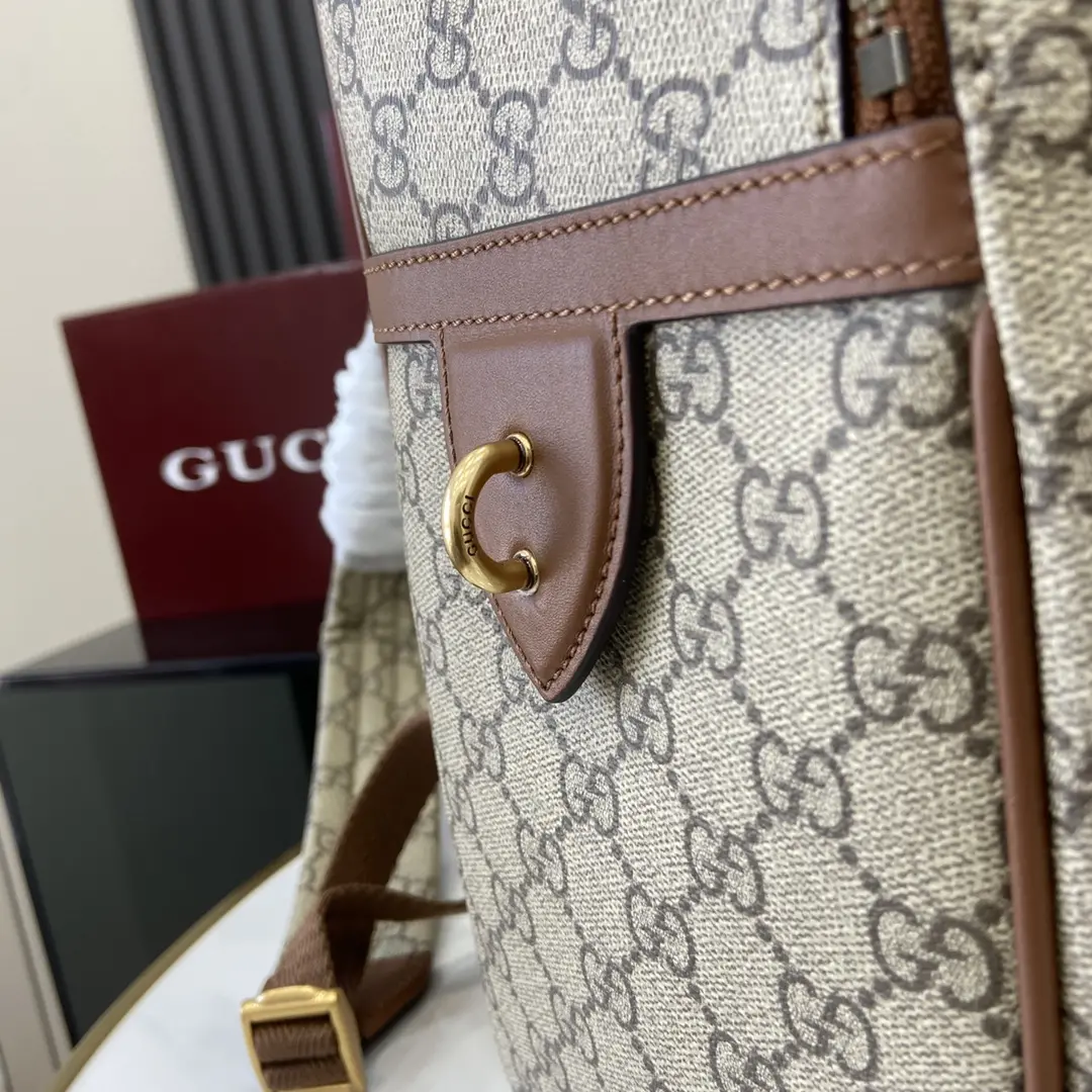 p1380 Gucci Brown Emblem Shoulder Bag Men's travel accessories reinterpret the timeless elegance and craftsmanship of the brand This backpack is crafted in the new beige and dark brown GG monogrammed fabrics Multi-functional pockets inside and D-rings on the outside for hanging accessoriesNew GG monogrammed fabric in beige and dark brownBrown leather pipingCotton liningpadded backInterior: 1 padded laptop compartment, 1 pen pocket and 1 zippered pocketExterior: 1 zippered front pocket and 1 D-ringZipper closureModel: 821159Dimensions: 31cm (W) x 41cm (H) x 18cm (D)Weight: approx. 1.45 kgColor: brown pvc/originalItalian Creation