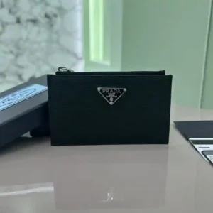 PRADA Card Case 2MC086 Inside Size 164 OEM This zippered leather card holder is a stylish, elegant and sophisticated piece featuring 5 card slots adorned with the iconic enameled triangular metal logo Size: 13*8cm-High-fashion bags